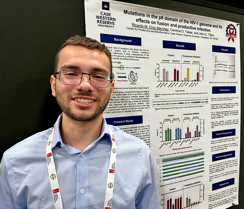 Image of Ricardo Cruz-Sanchez near his poster